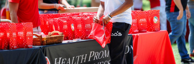 Student attends the Health Promotion and Wellness booth at Festival ISU.